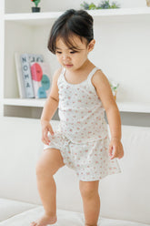 Toddler stepping down in Avauma rose belle tank top and shorts